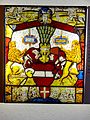 The Austrian Bindenschild, gules a fess argent, originally the Babenberg coat of arms. Below the Bindenschild is a small coat of arms of the city of Vienna, gules a cross argent [9]