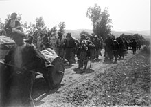 Armenian deportatees from Erzurum walking along dirt road