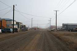 Street view of Utqiagvik in July 2008. This street, like all the others in Utqiagvik, has been left unpaved due to the prevalence of permafrost.