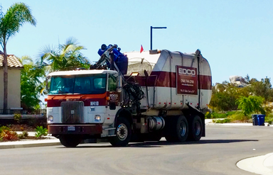 An EDCO Heil automated side loader collecting trash in Vista, California, US.