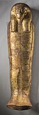 Golden coffin lid shaped like a mummy