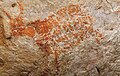 Image 73The oldest known figurative painting is a depiction of a bull that was discovered in the Lubang Jeriji Saléh cave in Indonesia. It was painted 40,000–52,000 years ago or earlier. (from Painting)