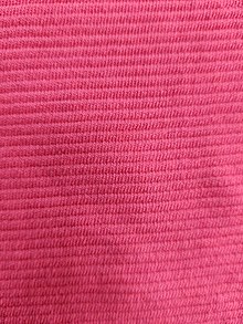 A bright pink fabric with small, widthways ribs