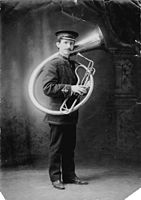 Philip Timms with his E♭ bass helicon in 1909