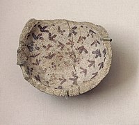Fragment of pottery with incised and painted decor. From Tell Hassuna, 6500 - 6000 BC.
