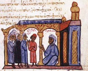 Medieval miniature showing a prisoner in red being interviewed by a seated figure wearing a turban, amid the latter's court
