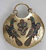 Front of a temple pendant with two birds flanking a tree of life; 11th–12th century; cloisonné enamel & gold; overall: 5.4 by 4.8 by 1.5 centimetres (2.13 in × 1.89 in × 0.59 in); made in Kyiv (Ukraine); Metropolitan Museum of Art (New York City)