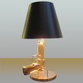 Gold plated gun lamp designed for Flos (2005)
