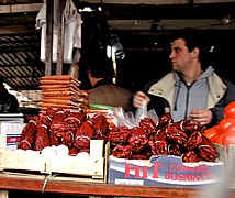 Packaged ground and whole dried paprika for sale at a marketplace in Belgrade, Serbia