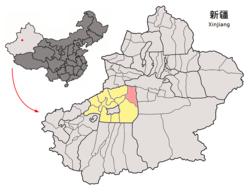 Location of Kucha within Xinjiang with the county of Kucha in pink and the prefecture of Aksu in yellow