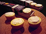 Commercially-made petits fours consisting of raclette cheese in boiled potatoes