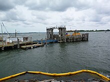 A ferry pier jutting into the water from the left-hand side of the image