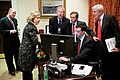 Mosteller works on a speech with Secretary Clinton and other administration staff.