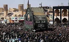 A symbolic bier of Husayn (nakhl) in a mock funeral (nakhl-gardani) in Iran
