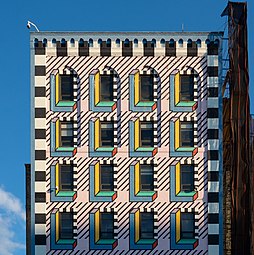 Memphis Group-inspired mural on a 7-storey building, Brooklyn, NYC, by Camille Walala, probably 2018, mural on a brick wall