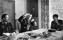 Photo of three German officers sitting at the table