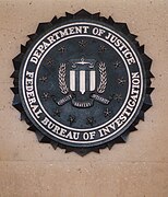 A metal-cast version of the FBI seal at the entrance of the J. Edgar Hoover Building in Washington D.C.