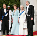 President George W. Bush and First Lady Laura Bush with Queen Elizabeth II and Prince Philip, Duke of Edinburgh at the beginning of an official dinner at the White House, 2007