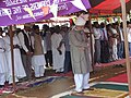 Khalifatul Massih V leading prayers on the pitch of the Jamia during his visit in 2004