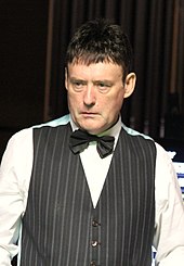 Jimmy White wearing a waistcoat and bow tie