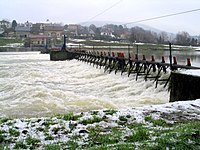 A manually operated needle dam-type weir near Revin on the River Meuse, France