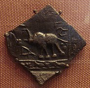 Satavahana 1st century BCE coin inscribed in Brahmi: "(Sataka)Nisa". British Museum