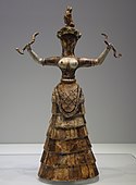 Snake goddess; 1460-1410 BC (from the Minoan Neo-palatial Period); faience; height: 29.5 cm; from the Temple Repository at Knossos; Heraklion Archaeological Museum[14]