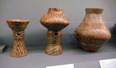 Polychrome vessels (from left to right): a bowl on stand, a vessel on stand and an amphora, by the Cucuteni–Trypillia culture, c. 4300–4000 BC, fired clay with paint, Palace of Culture, Iași, Romania