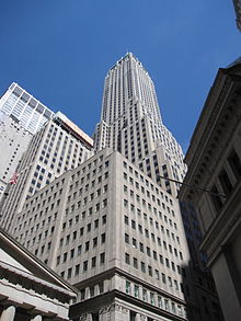 A street-level view looking up at a setback tower, demonstrating the sunlight allowed to the ground in contrast to the Equitable Life Building shown earlier