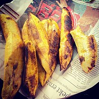 Ghanaian Kɔkɔ a y'atoto (nickname: Kofi Broke Man) charcoal-roasted ripe plantain