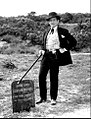 Gene Barry as Bat Masterson standing next to Lester Moore's grave in 1960