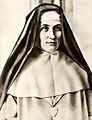 The religious habit of the Sisters of the Good Shepherd (and also of the Sisters from the Order of Our Lady of Charity) is white, with a white scapular, a black veil and a large silver heart on the breast