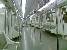 Interior of a metro car, with limited seating