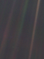 Image 22 Pale Blue Dot Photo credit: NASA/JPL Pale Blue Dot is the name given to this 1990 photo of Earth taken from Voyager 1 when its vantage point reached the edge of the Solar System, a distance of roughly 3.7 billion miles (6 billion kilometres). Earth can be seen as a blueish-white speck approximately halfway down the brown band to the right. The light band over Earth is an artifact of sunlight scattering in the camera's lens, resulting from the small angle between Earth and the Sun. Carl Sagan came up with the idea of turning the spacecraft around to take a composite image of the Solar System. Six years later, he reflected, "All of human history has happened on that tiny pixel, which is our only home." More selected pictures