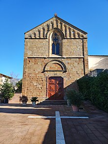 Brick church with a car parked in front
