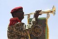 A Djiboutian soldier plays the trumpet to welcome Djibouti's President to Beletweyne, Somalia.