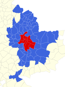 The city (commune) of Lyon (in red) and 58 suburban communes (in blue) make up the metropolitan region.