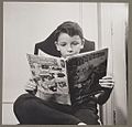New York, N.Y. Children's Colony, German refugee child, reading a Superman comic book