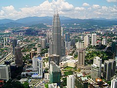 Petronas Towers within Kuala Lumpur cityscape