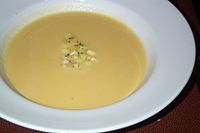 An apple and parsnip soup topped with apple relish