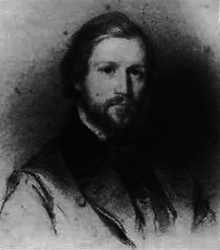 Portrait of a bearded man in his early 20s, with combed hair
