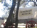 Covered wagon sign attracts motorists off Highway 97 to the Longhorn Museum in Pleasanton.