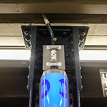 Image of a camera above a New York City subway help point