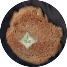 A [[scanography|scanogram]] of a cannibis edible peanut butter cookie with a digestible THC warning label