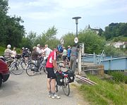 Cyclists waiting at a ferry crossing, Ufer, Austria.