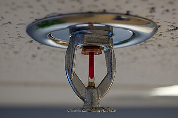Fire sprinkler mounted on a roof