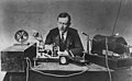 Guglielmo Marconi, generally credited as first to develop practical radio-based wireless telegraphy communication, in 1901 with one of his first transmitters (right) and receivers (left)