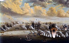 A dramatic rendering of a scene from a naval battle. Along the left edge is a row of Swedish sailing ships firing their guns at an oncoming Russian galley and a confused cluster of Russian sailing ships further off to the right with a row of Russian gunboats extending to the right of the image. At the bottom of the painting is a curved line of Swedish oared gunboats, firing onto a Russian gunboats. In the background there are still more ships engaged in battle. Virtually all vessels in the painting are firing, filling the air with dense, white gunpower smoke. In both the Swedish and Russian gunboat line, there are boats in the midst of powerful explosions, throwing men and debris high into the air.
