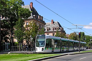 Tram on Line T3a on green track in front of the Cité Internationale Universitaire de Paris