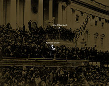 President Lincoln at his second inauguration with John Wilkes Booth looking onwards with many others